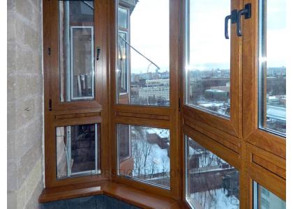Французское остекление балкона профилем Veka с ламинированием под дерево в Долгопрудном