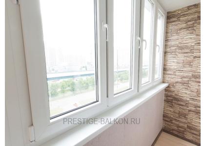 Тёплое остекление балкона профилем КВЕ и комбинированной отделкой пластиком и деревом в Долгопрудном